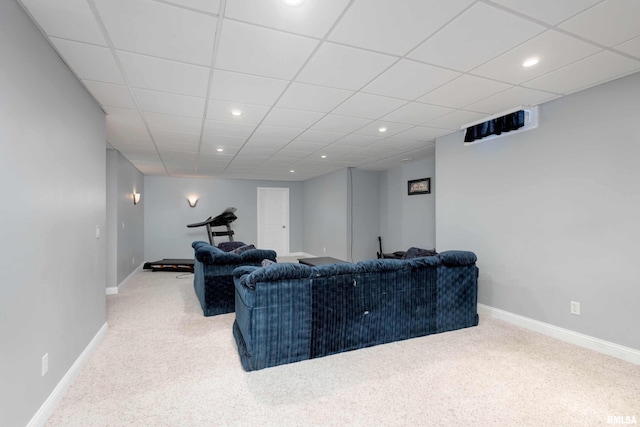 living room featuring recessed lighting, light colored carpet, a paneled ceiling, and baseboards