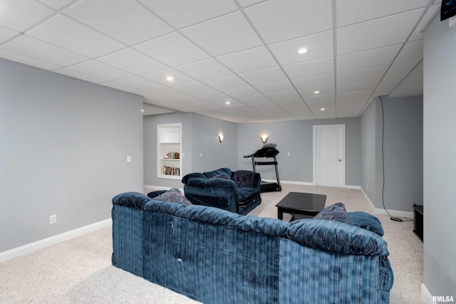 living room with built in shelves, baseboards, carpet flooring, and recessed lighting