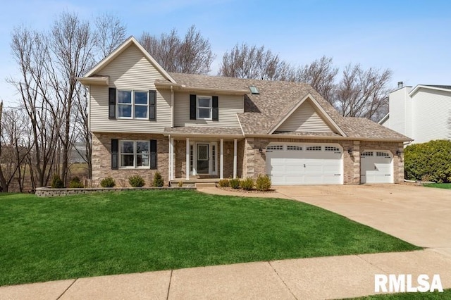 view of front of property with concrete driveway, brick siding, an attached garage, and a front yard