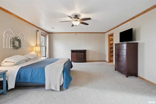 bedroom featuring ceiling fan, light carpet, visible vents, baseboards, and ornamental molding