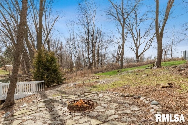 view of yard with a patio and a fire pit