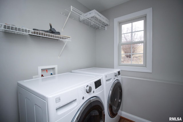 laundry area featuring laundry area and independent washer and dryer