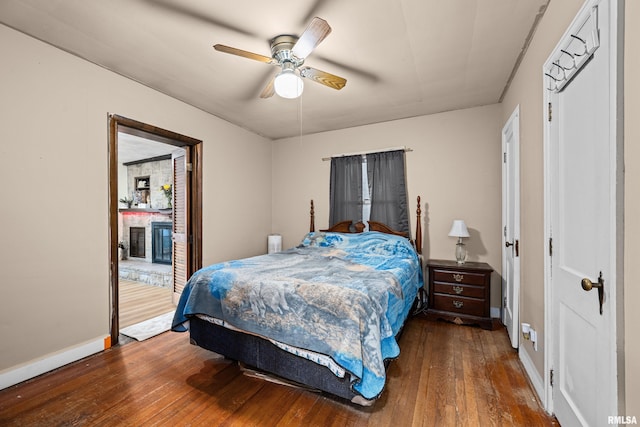 bedroom featuring baseboards, ceiling fan, and hardwood / wood-style floors