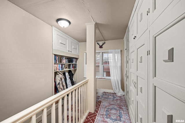 corridor featuring brick floor