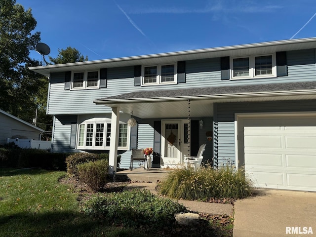 view of front of property featuring a porch and a garage