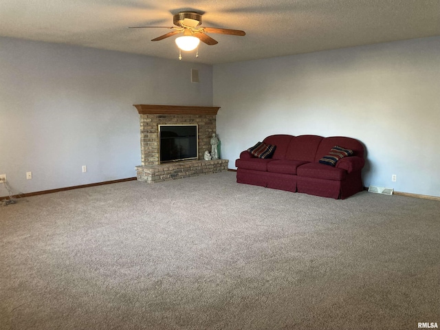 unfurnished living room with visible vents, carpet flooring, a fireplace, a textured ceiling, and a ceiling fan