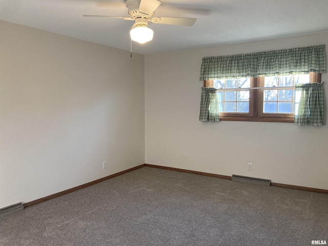 carpeted spare room with visible vents, ceiling fan, and baseboards