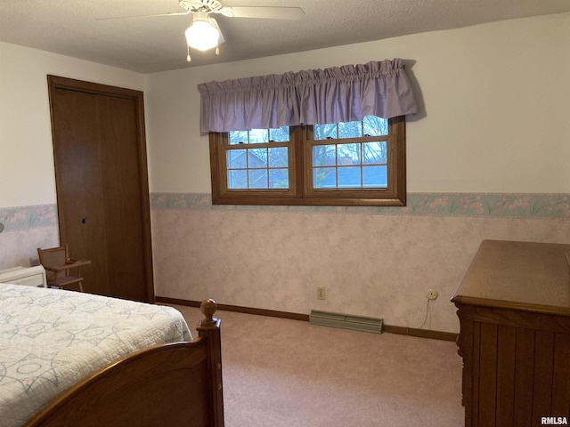 bedroom with visible vents, carpet, a wainscoted wall, and a ceiling fan