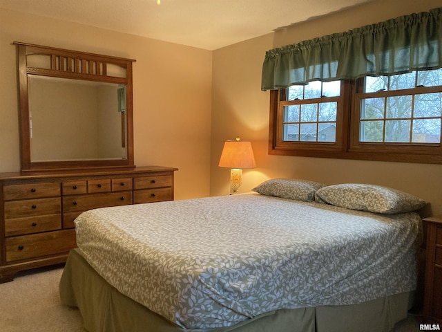 bedroom featuring light carpet