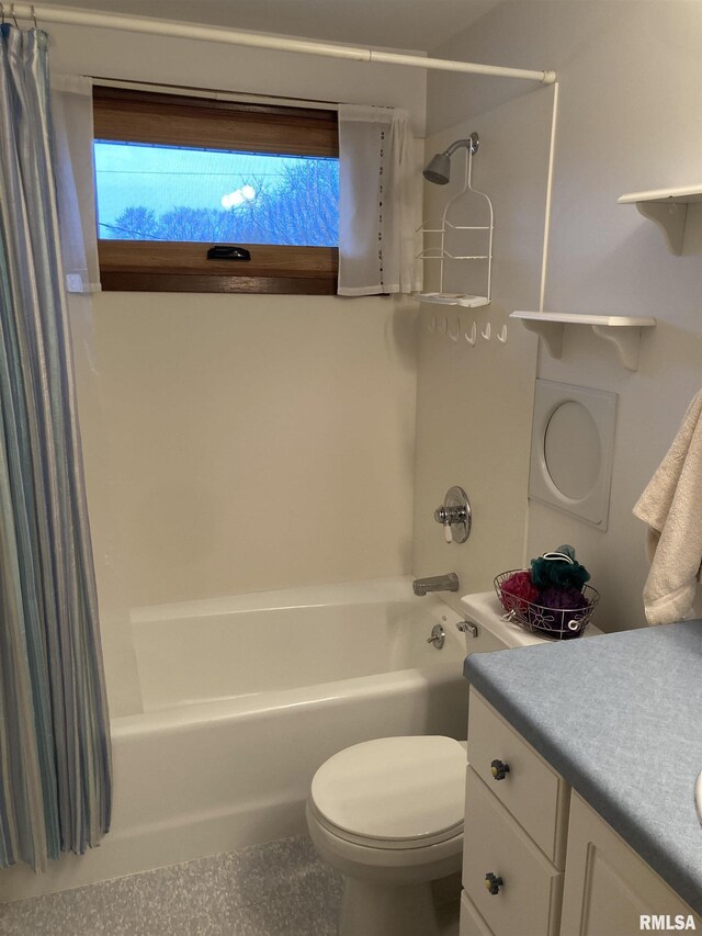 full bathroom featuring toilet, shower / bath combo, and vanity