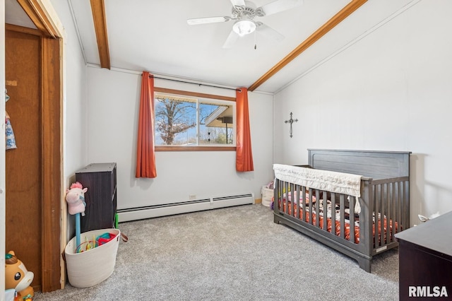 carpeted bedroom featuring a nursery area, ceiling fan, a baseboard radiator, and vaulted ceiling with beams