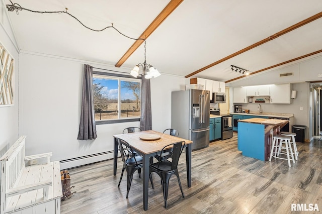 dining space with light wood finished floors, visible vents, a baseboard radiator, vaulted ceiling with beams, and a notable chandelier