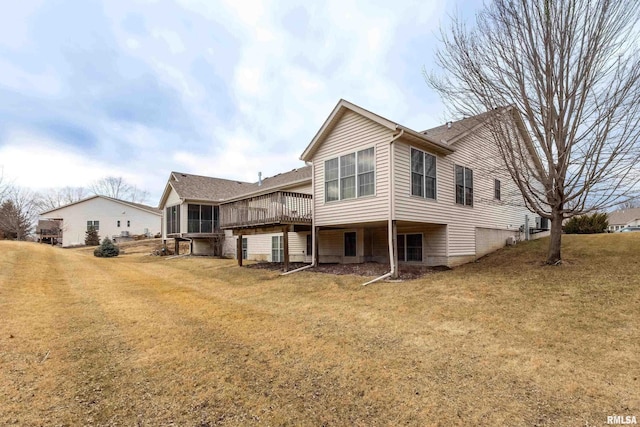 rear view of property featuring a yard