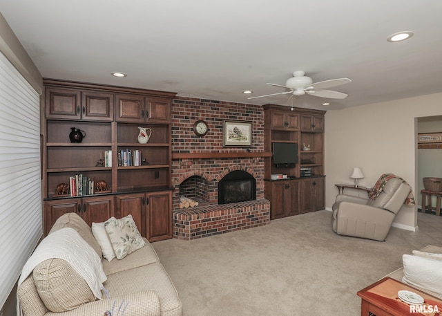 living room with recessed lighting, light colored carpet, a fireplace, and ceiling fan