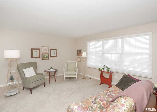 living room with carpet floors and baseboards