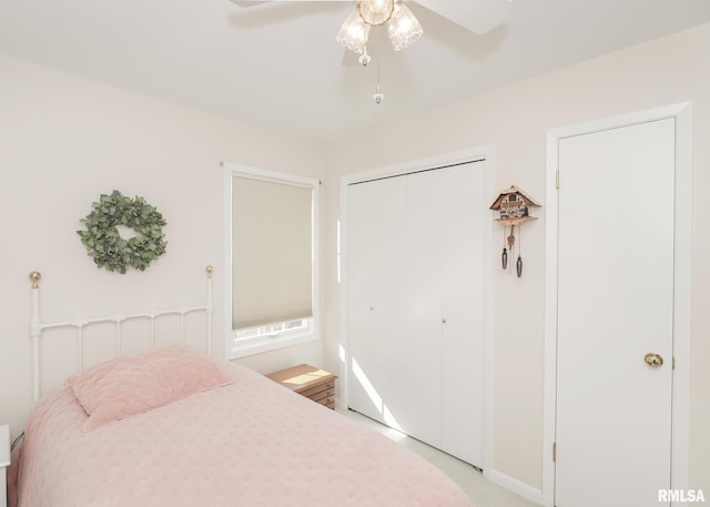 bedroom featuring a ceiling fan and a closet