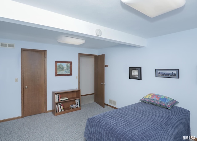 bedroom featuring baseboards, visible vents, and carpet flooring