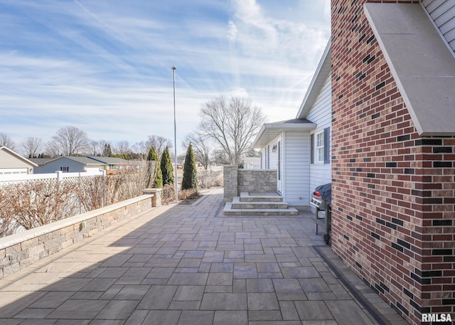 view of patio / terrace with fence