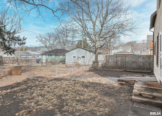 view of yard with a residential view and a fenced backyard