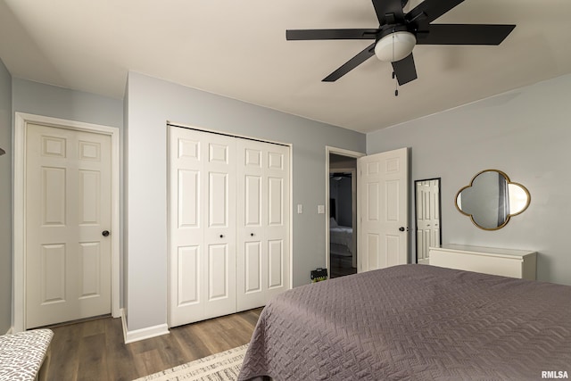 bedroom with a ceiling fan, a closet, and wood finished floors