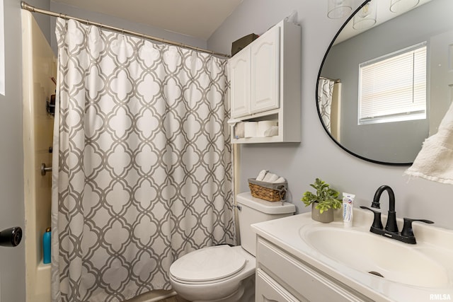 full bathroom with shower / bath combination with curtain, vanity, and toilet