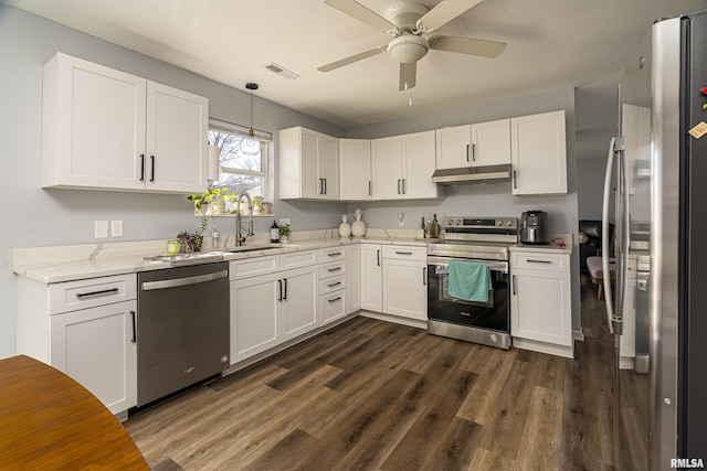 kitchen featuring stainless steel appliances, dark wood-style flooring, visible vents, and under cabinet range hood