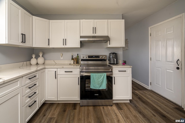 kitchen featuring under cabinet range hood, dark wood-type flooring, white cabinets, and stainless steel range with electric cooktop