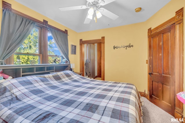 bedroom with carpet and a ceiling fan