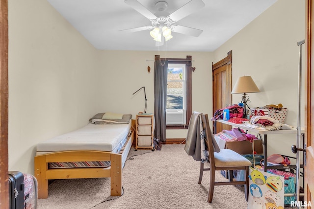 carpeted bedroom with a ceiling fan