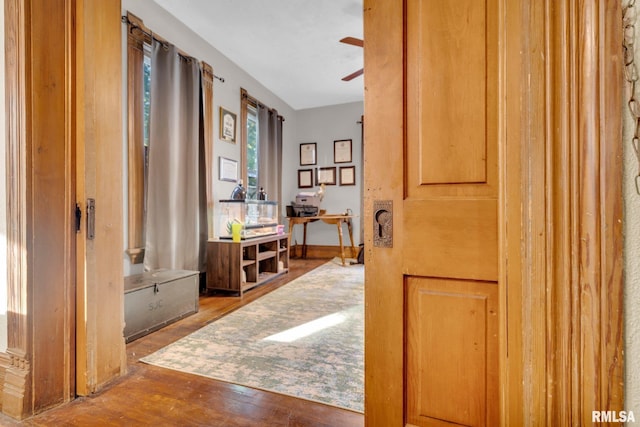 hall with wood finished floors