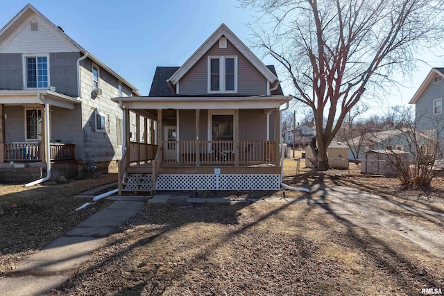 view of front of house featuring a porch and a shingled roof