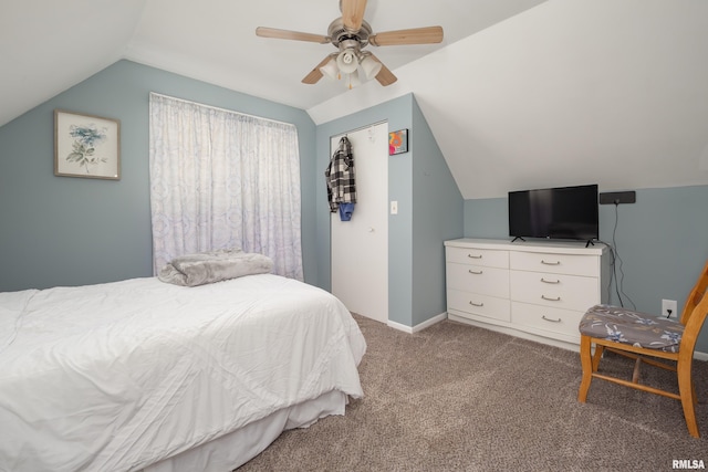 carpeted bedroom featuring lofted ceiling, baseboards, and a ceiling fan