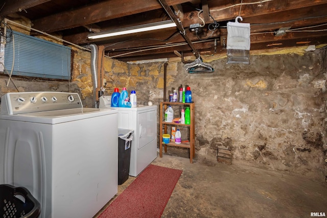 unfinished below grade area featuring separate washer and dryer