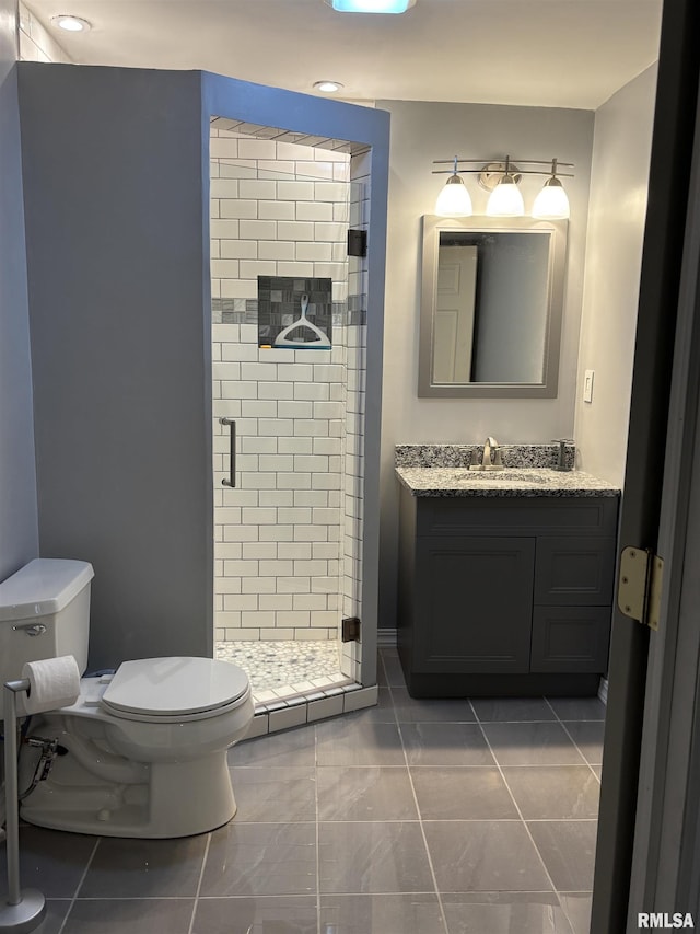 full bath with toilet, a shower stall, and vanity