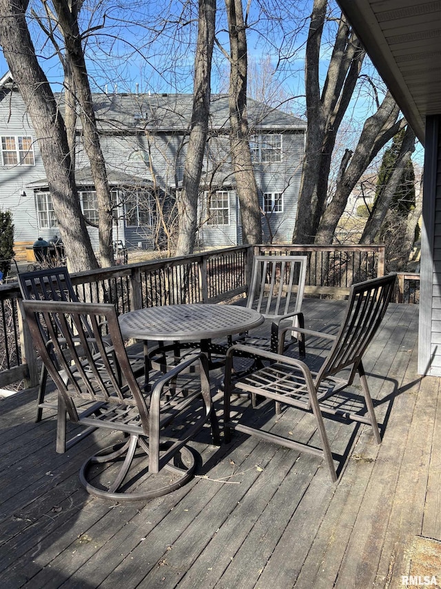 wooden deck with outdoor dining area