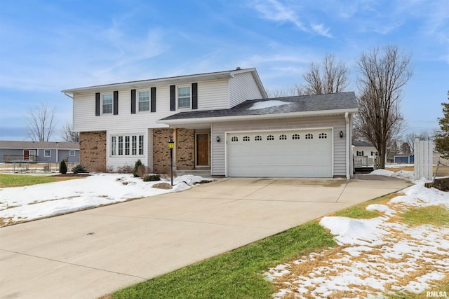 traditional-style home featuring concrete driveway and an attached garage