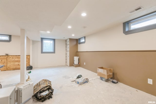 below grade area featuring recessed lighting and visible vents