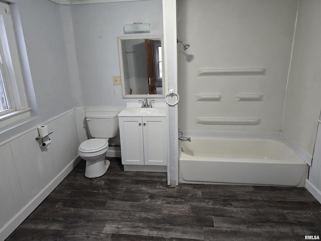 full bathroom featuring shower / bathtub combination, vanity, wood finished floors, and toilet