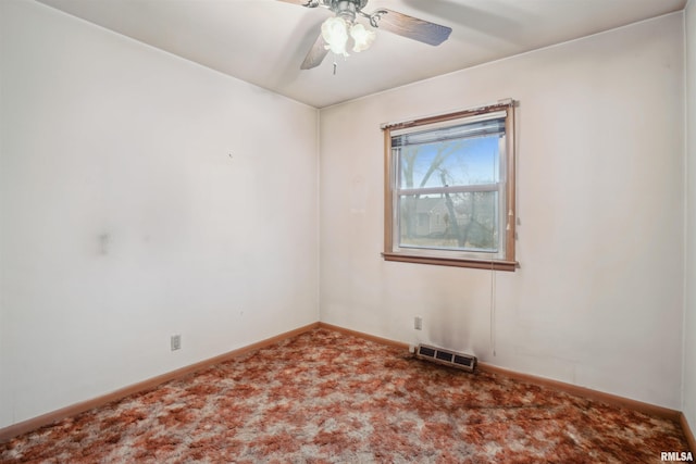 carpeted empty room with a ceiling fan, visible vents, and baseboards