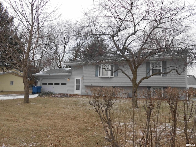 exterior space with a garage and a yard