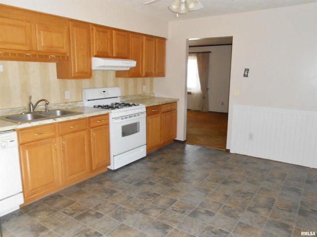 kitchen featuring ceiling fan, under cabinet range hood, white appliances, a sink, and light countertops