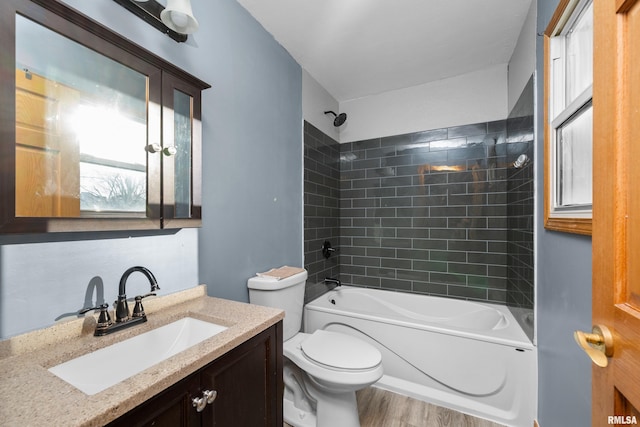 full bathroom with shower / bathing tub combination, vanity, toilet, and wood finished floors