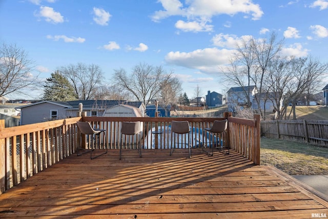 deck featuring a residential view and fence