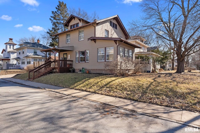 view of front of house featuring a residential view and a front lawn