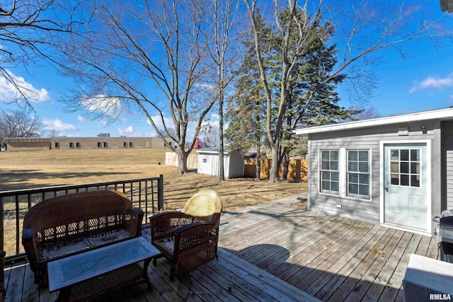 deck with a shed and an outdoor structure