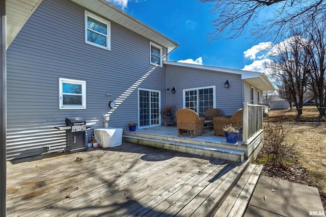 wooden terrace featuring area for grilling