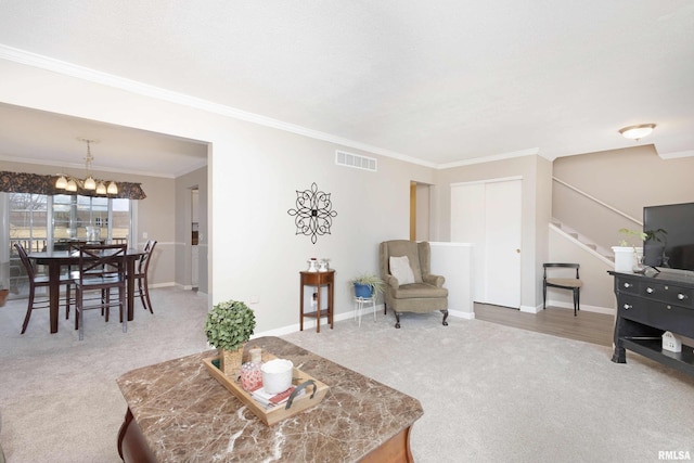 carpeted living room with crown molding, visible vents, stairway, an inviting chandelier, and baseboards