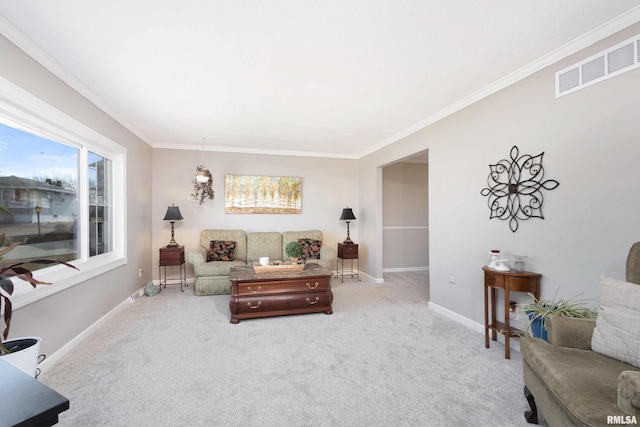 carpeted living area featuring baseboards, visible vents, and ornamental molding