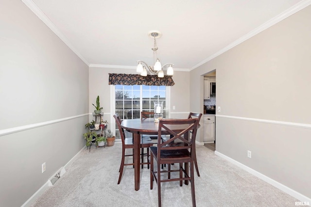 dining area featuring light carpet, crown molding, baseboards, and a notable chandelier