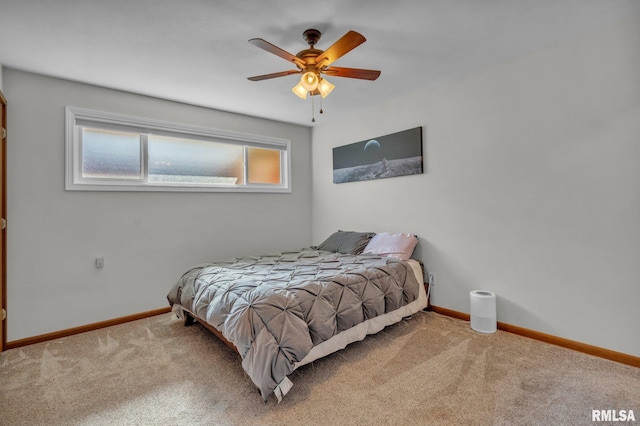 bedroom featuring carpet floors, baseboards, and a ceiling fan